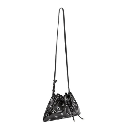 A black bucket bag with silver-tone grommets and a long shoulder strap, shown against a plain white background.
