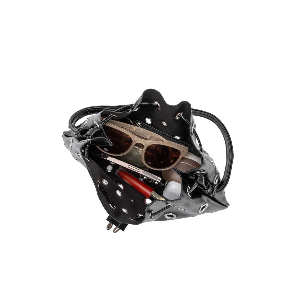 Black snow climbing device with sunglasses on a white background