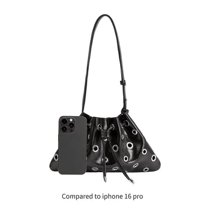 Black handbag with drawstring and smartphone on a white background
