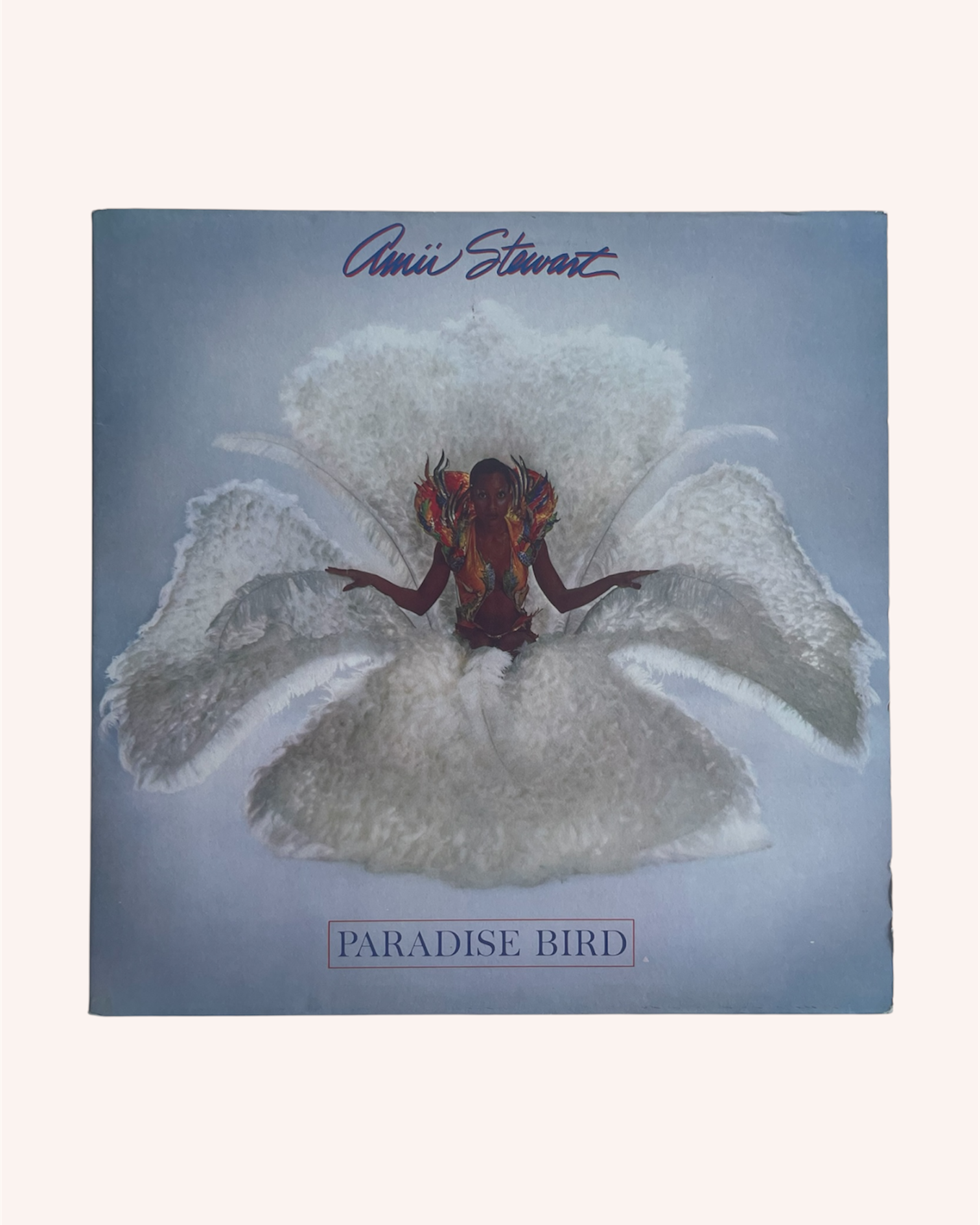 Album cover of 'Paradise Bird' by Annie Lenott with a person on a feather flower. Paradise Bird Vinyl Record - Amii Stewart