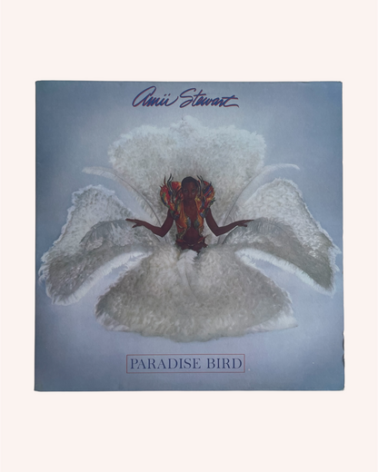 Album cover of 'Paradise Bird' by Annie Lenott with a person on a feather flower. Paradise Bird Vinyl Record - Amii Stewart