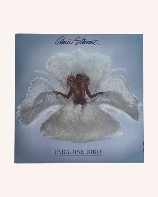 Album cover of 'Paradise Bird' by Annie Lenott with a person on a feather flower. Paradise Bird Vinyl Record - Amii Stewart