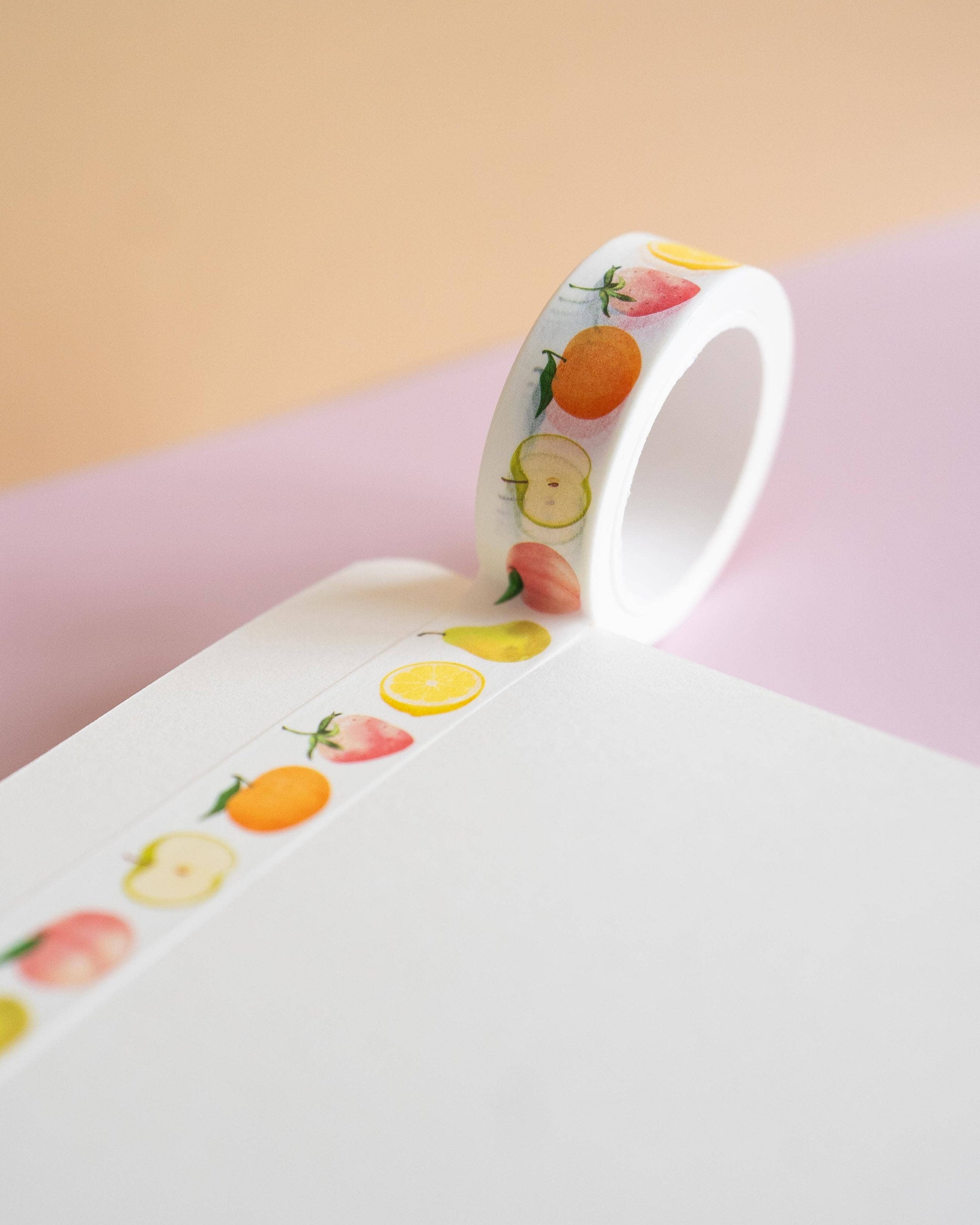 White band with fruit pattern on a pink surface