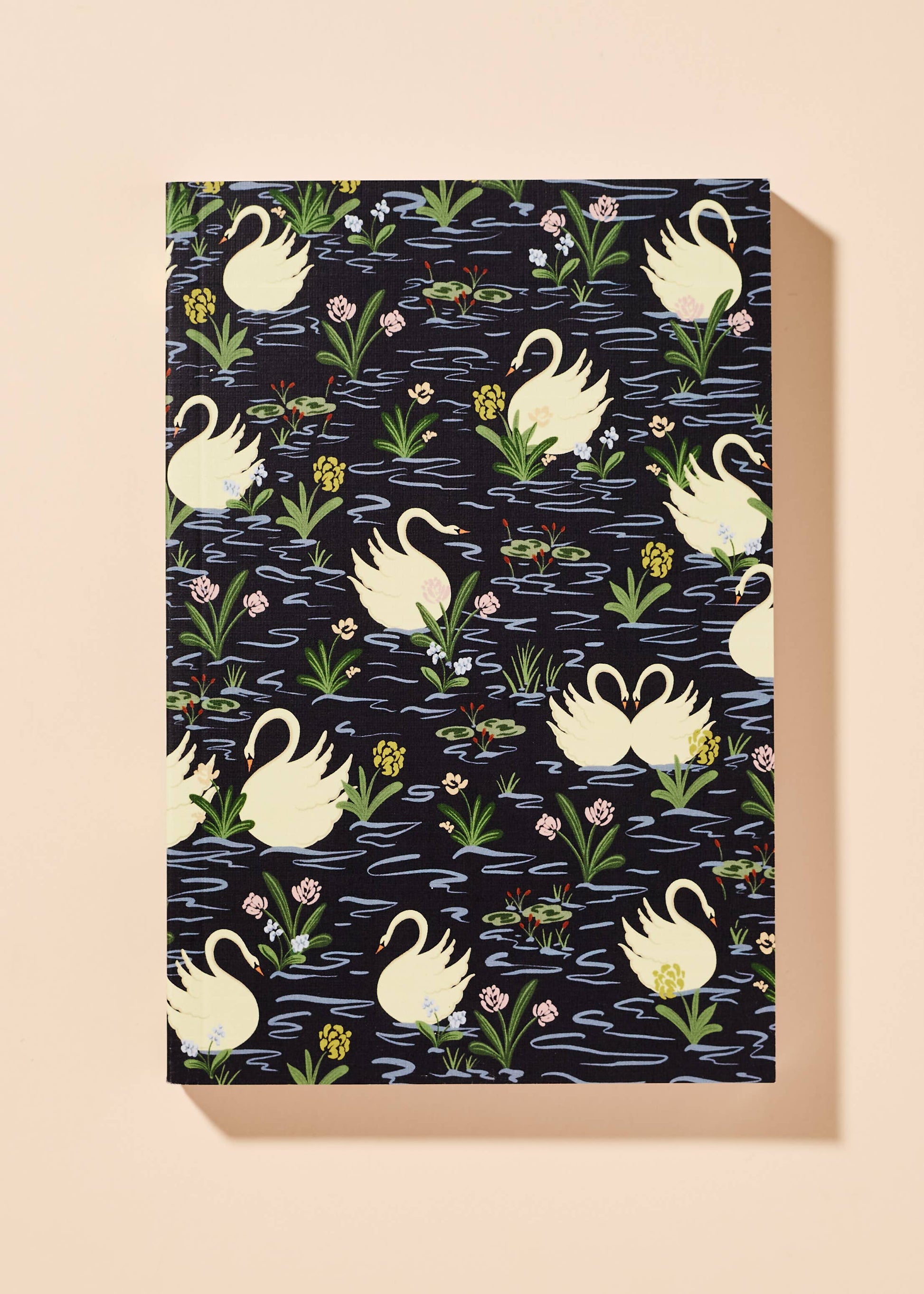 Notebook with swan pattern on a beige background