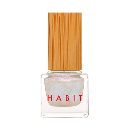 Nail polish with a wooden cap and 'Habit' branding on a white background