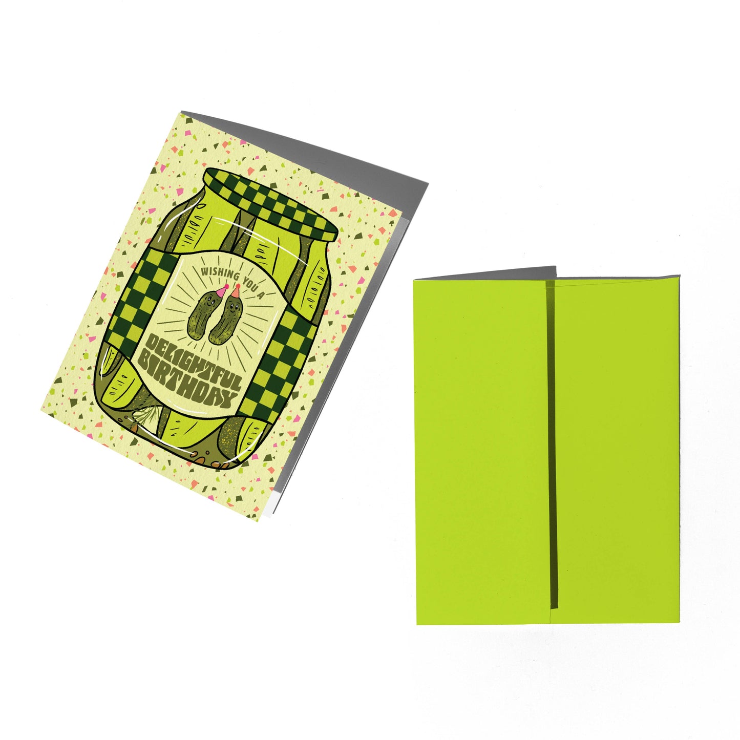 Greeting card with green checkered design and envelope on a white background