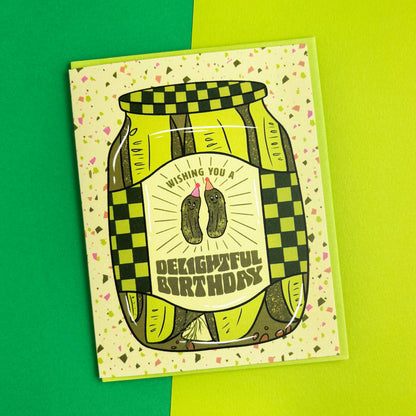 Birthday card with pickle design on a green background
