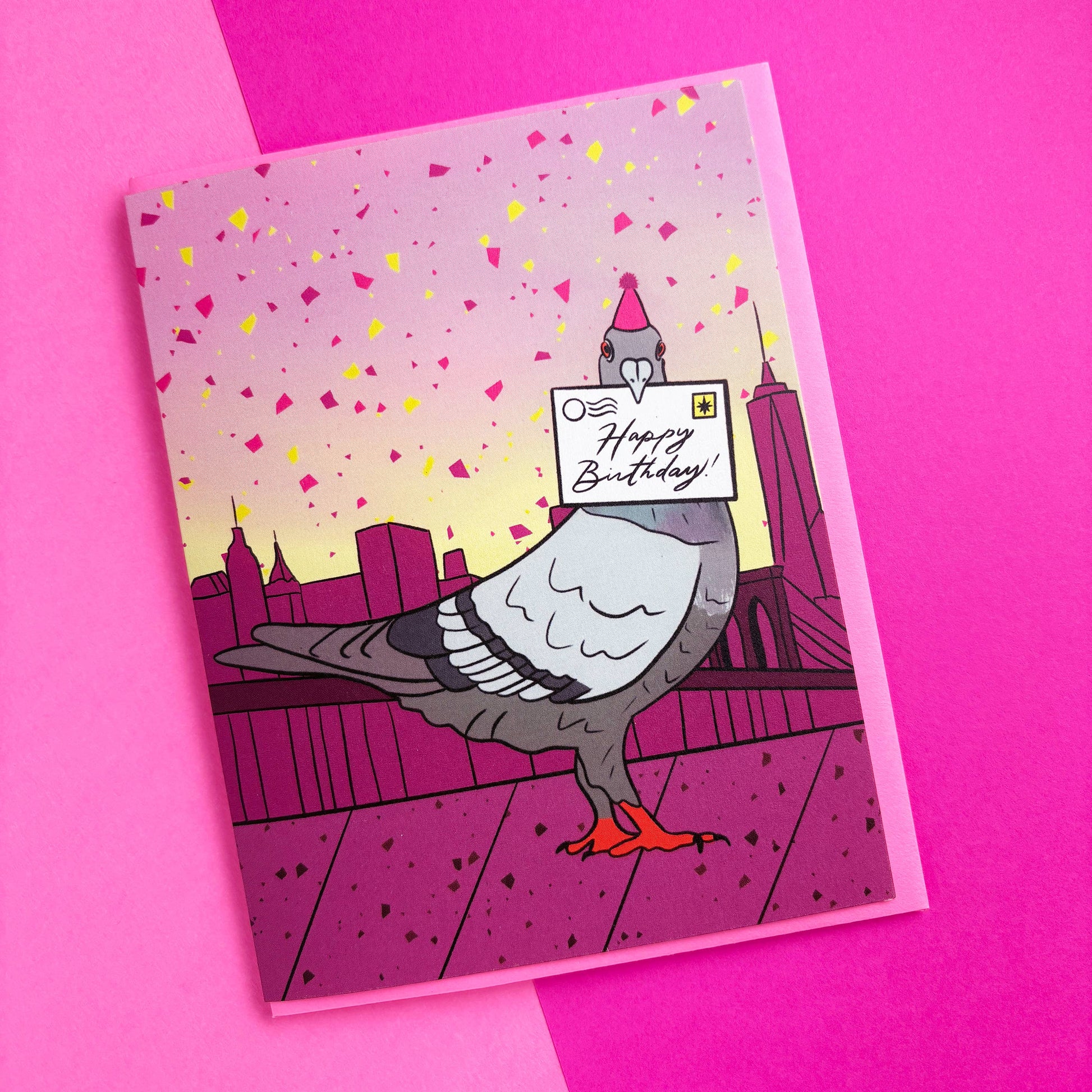 Greeting card with a pigeon holding a 'Happy Birthday!' sign on a pink background