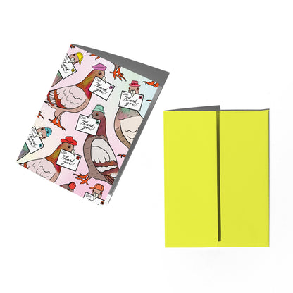 Notebook with colorful bird design on one cover and plain yellow cover on the other, on a white background.