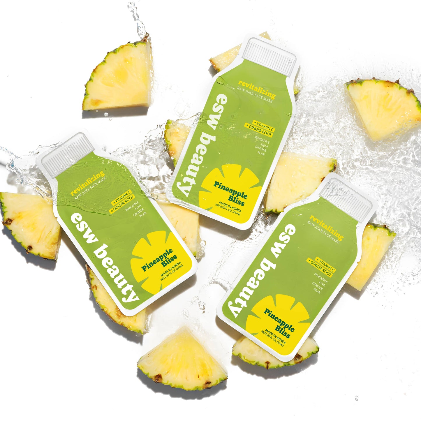 Three bottles of 'esw beauty' Pineapple Mix on a white background with pineapple slices.