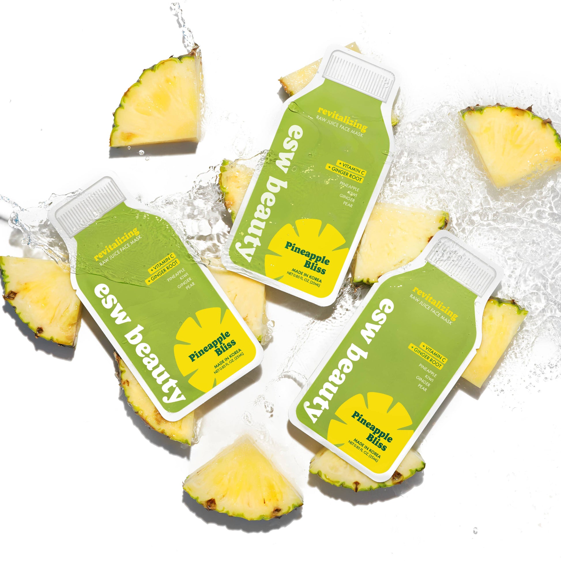 Three bottles of 'esw beauty' Pineapple Mix on a white background with pineapple slices.