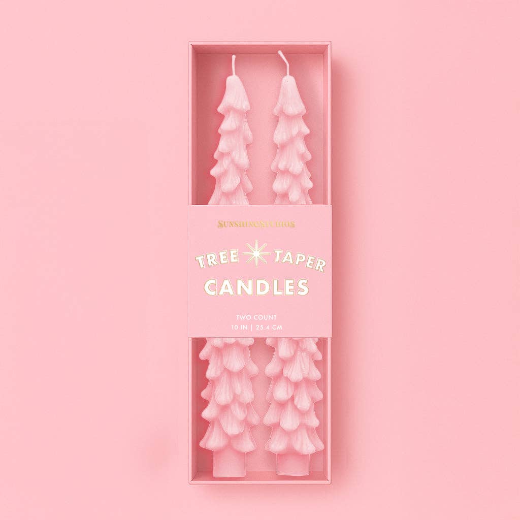 Tree taper candles in a pink box on a pink background