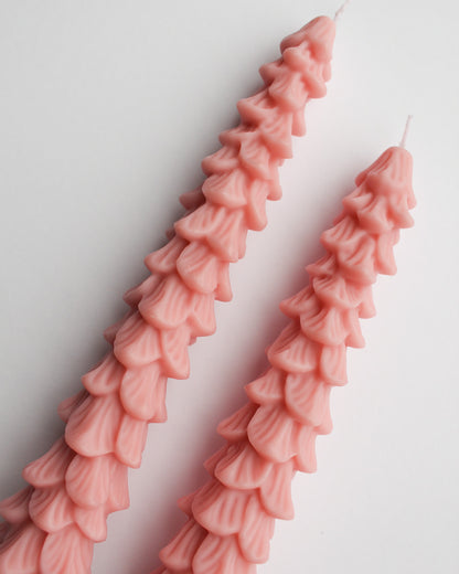 Pink ruffled candles on a white background, Pink Tree Taper Candles