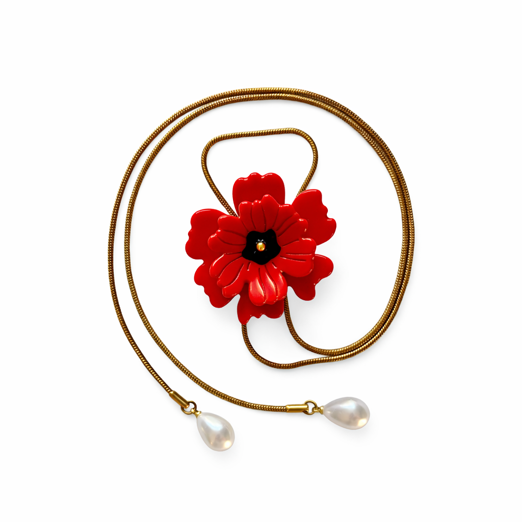 Necklace with a red flower pendant and pearl drops on a white background