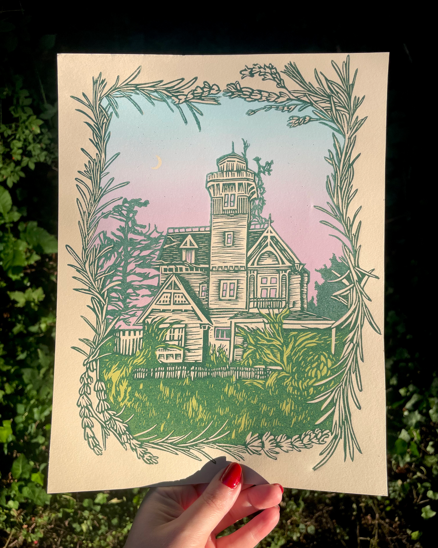 Illustration of a house with decorative elements held against a natural background