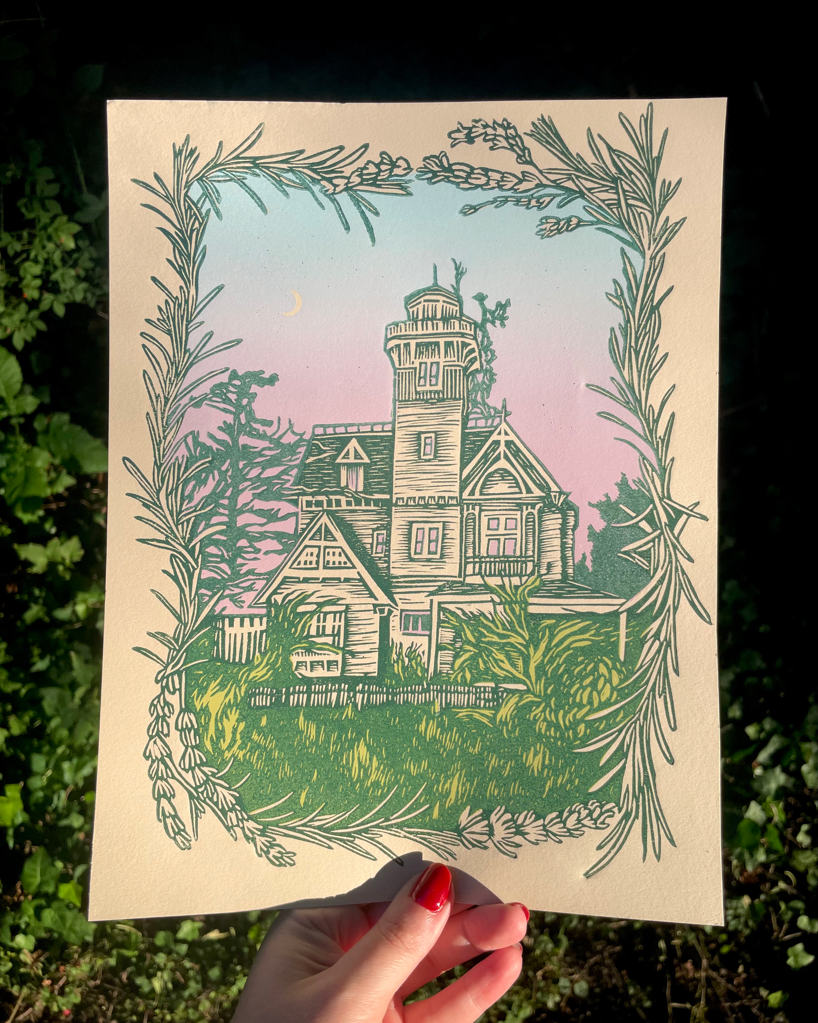 Illustration of a house with decorative elements held against a natural background