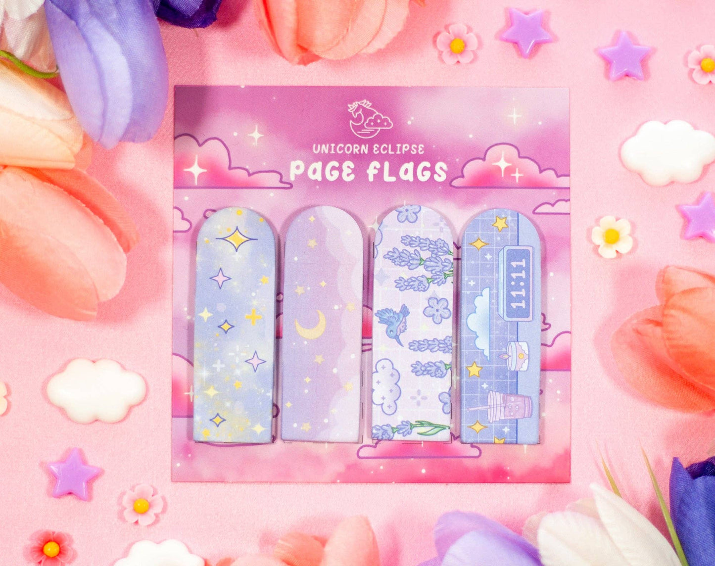 Pack of unicorn-themed page flags on a colorful background with flowers and stars.
