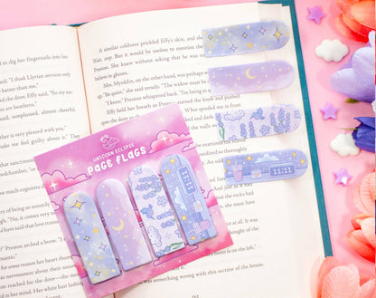 Set of colorful page flags with a pink packaging on an open book.