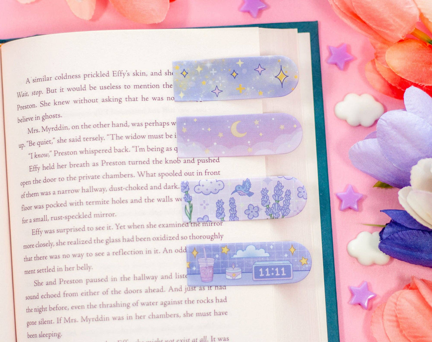 Book with decorative bookmarks on a colorful background