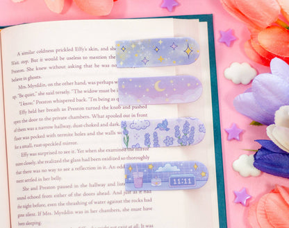 Book with decorative bookmarks on a colorful background