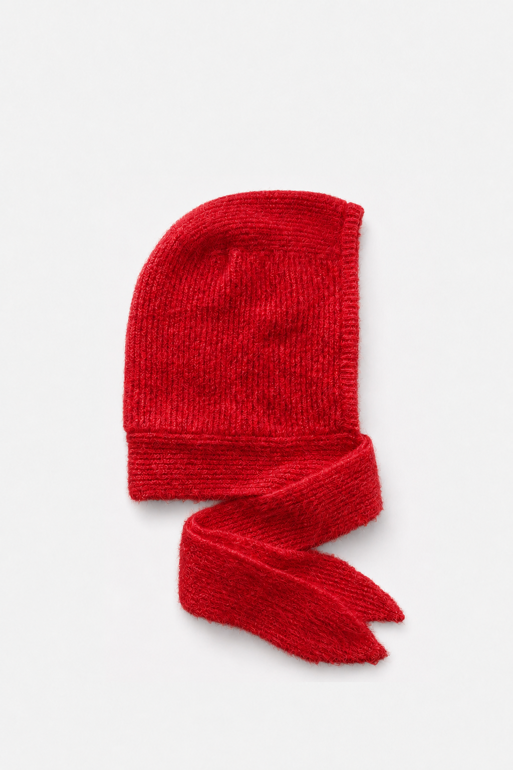 A bright red knit bonnet with an attached matching scarf, displayed on a clean light gray background.