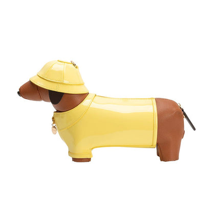 Dog-shaped bag with a yellow raincoat and hat on a white background
