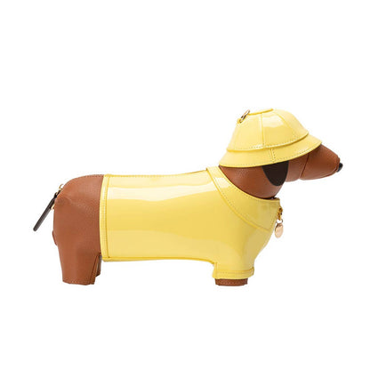Dog-shaped product wearing a yellow raincoat and hat on a white background