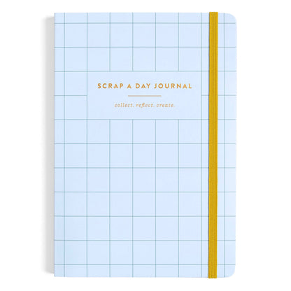 A light blue grid-bound journal with a yellow elastic closure band and gold foil text reading 'SCRAP A DAY JOURNAL' and 'collect. reflect.