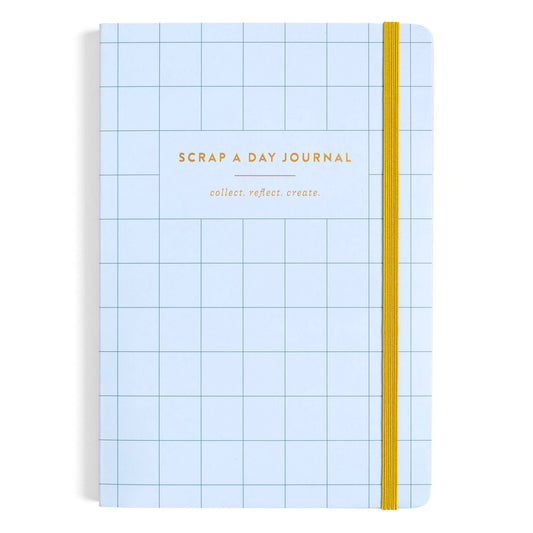 A light blue grid-bound journal with a yellow elastic closure band and gold foil text reading 'SCRAP A DAY JOURNAL' and 'collect. reflect.