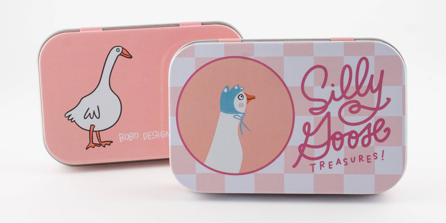 Two tin boxes with cartoon goose illustrations and 'Silly Goose Treasures!' text on a white background.