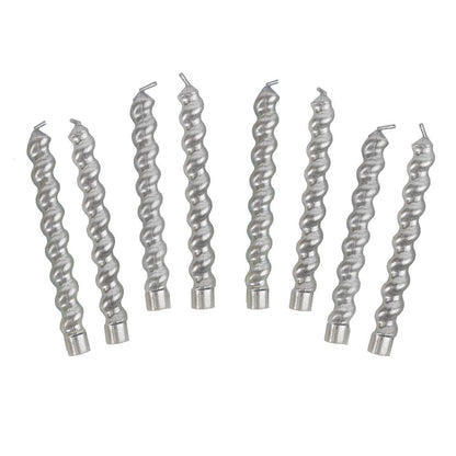 Set of silver spiral candles on a white background