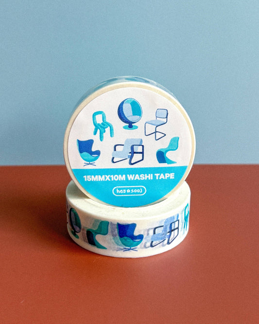 Washi tape with decorative design on a red surface and blue background