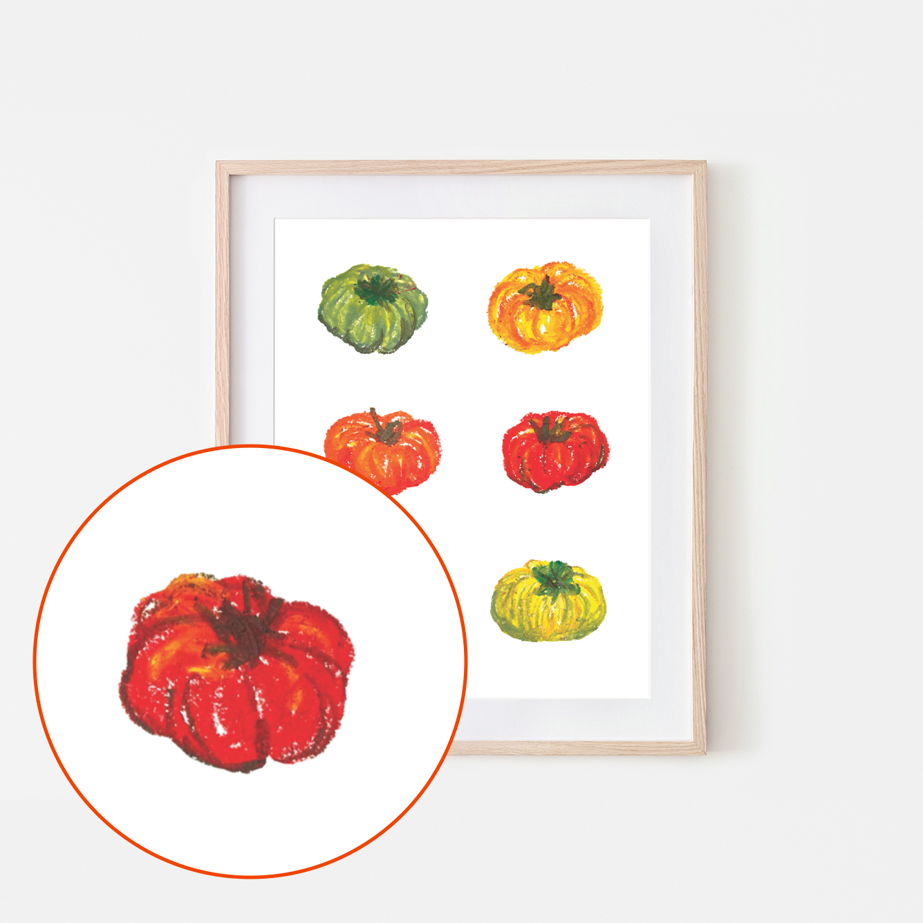 Framed artwork of colorful pumpkins on a white wall