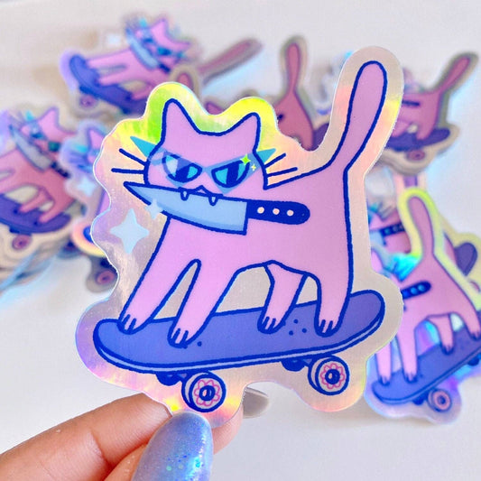 Holographic sticker of a pink cat riding a skateboard held by a hand. Skateboard + Knife Kuni Sticker, Radhia Rahman