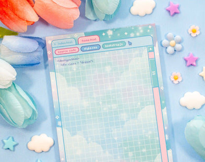 Notebook with grid paper on a colorful background with flowers and stars