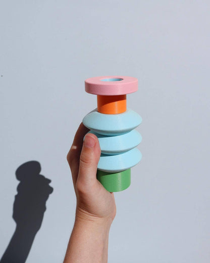 Space Color Block Vase with a hand holding it 