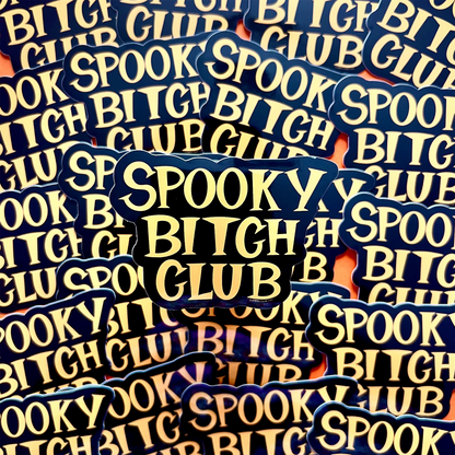 Stack of 'Spooky Bitch Club' stickers with blue and yellow text.