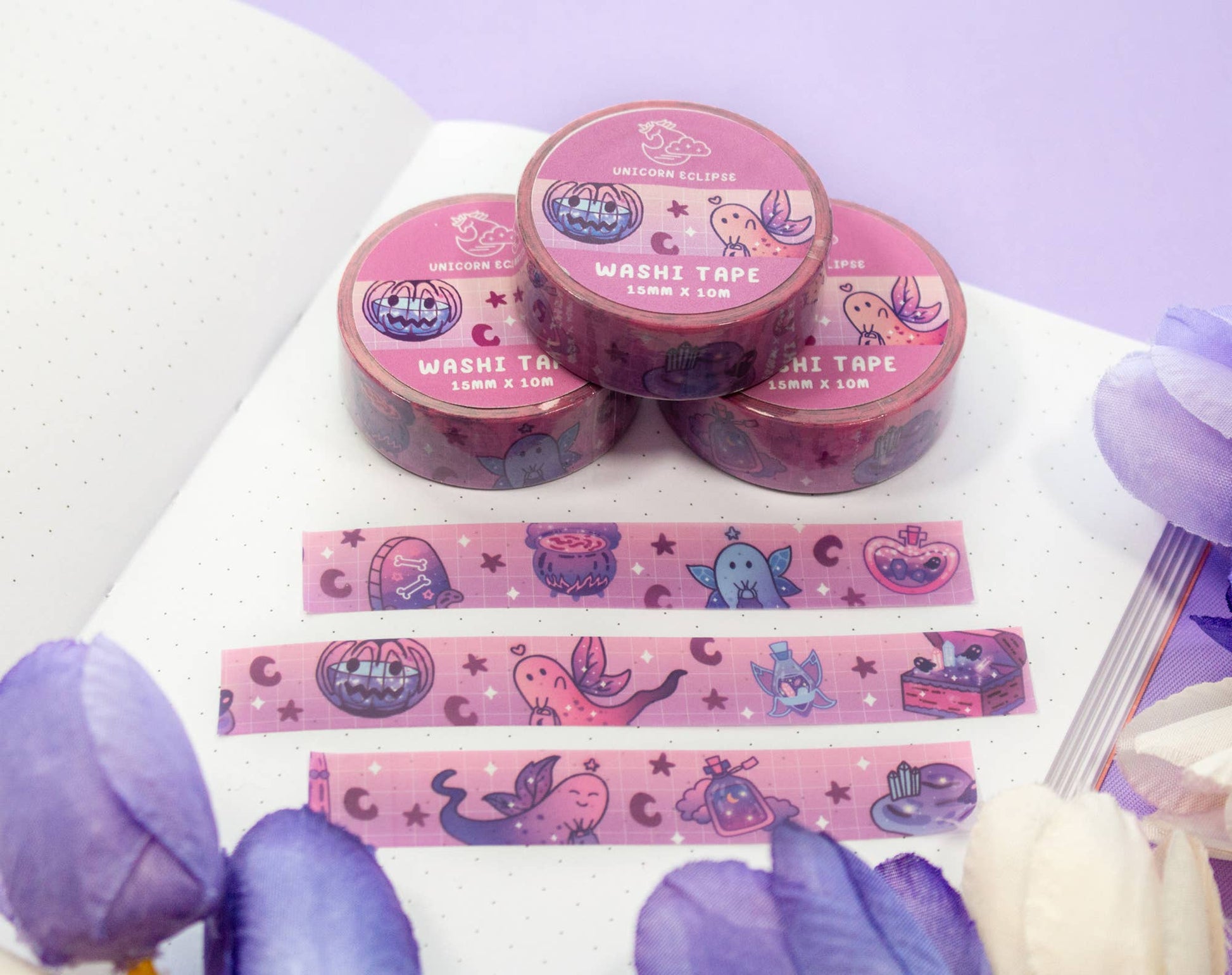 Washi tape with cartoon designs on a white surface