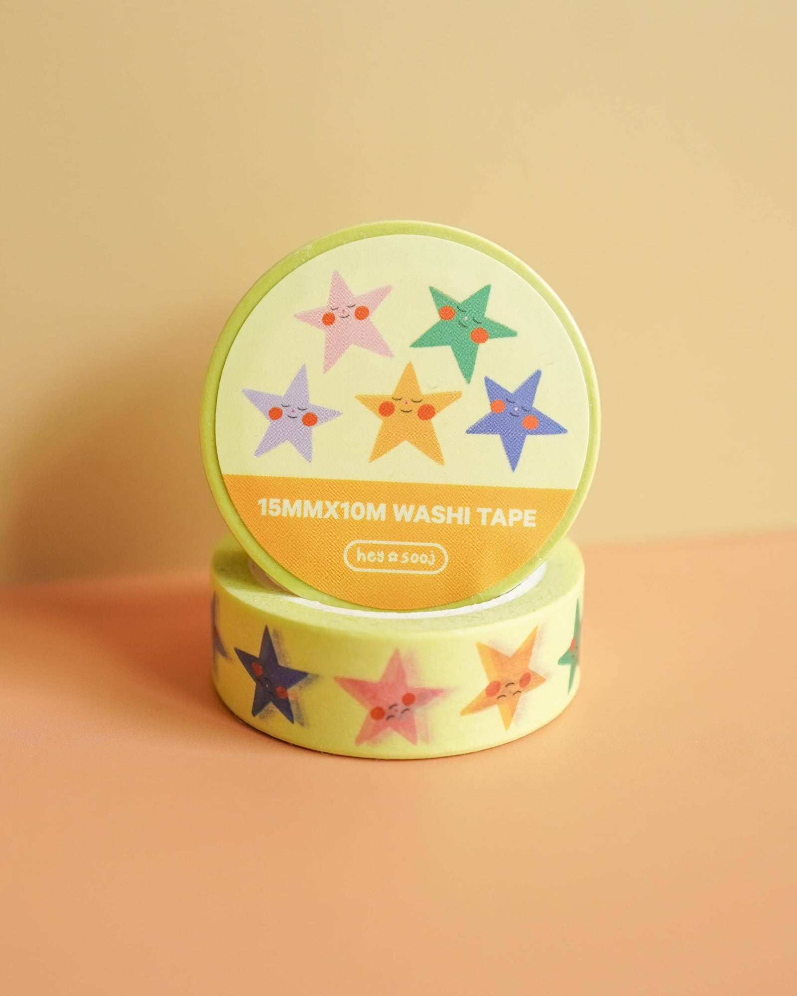 Two rolls of washi tape with star designs on a beige background, Stellar Washi Tape