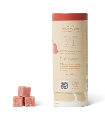 Tube of strawberry bellini mixer cubes.  with three pink cubes on a white background, Strawberry Bellini Mixer