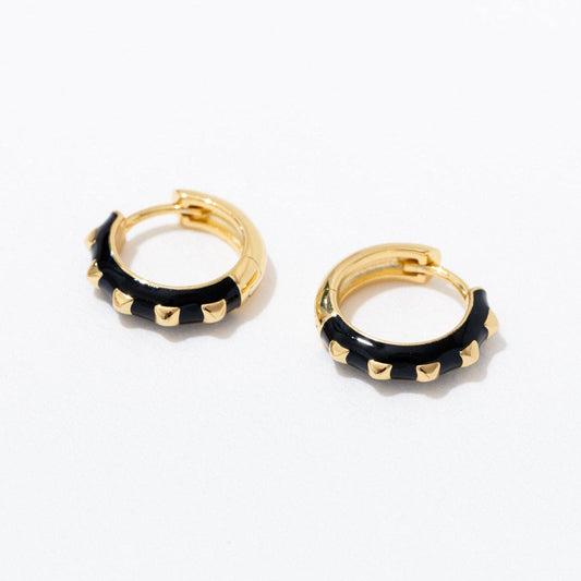 Gold hoop earrings with black accents on a white background