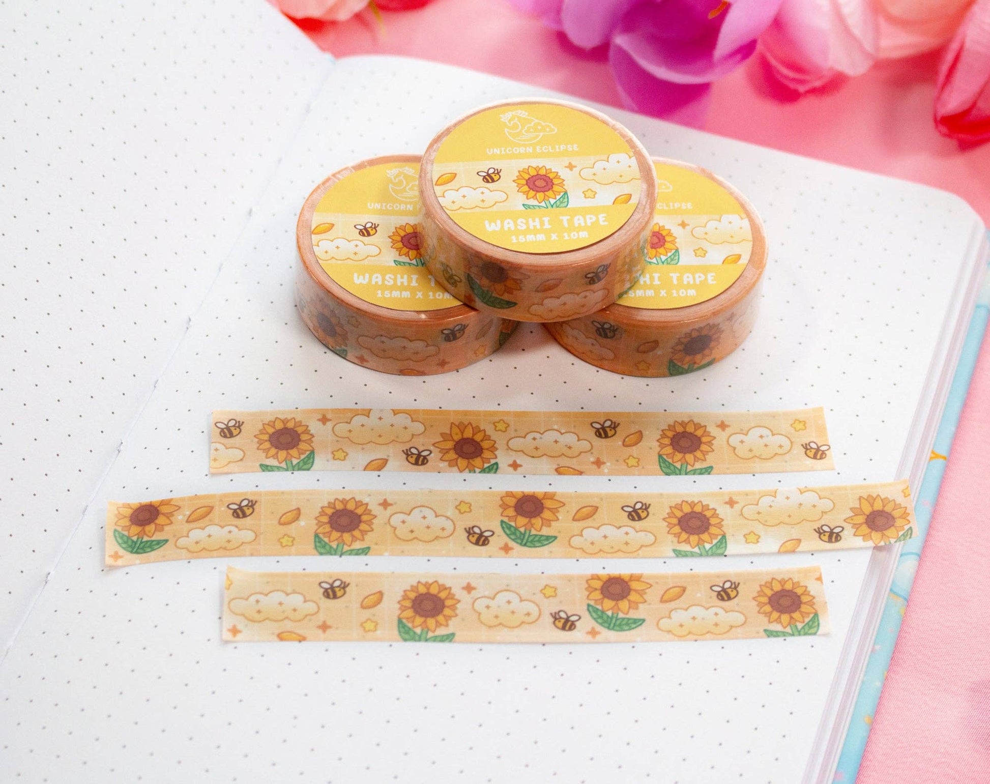 Decorative washi tape with sunflower design on a notebook