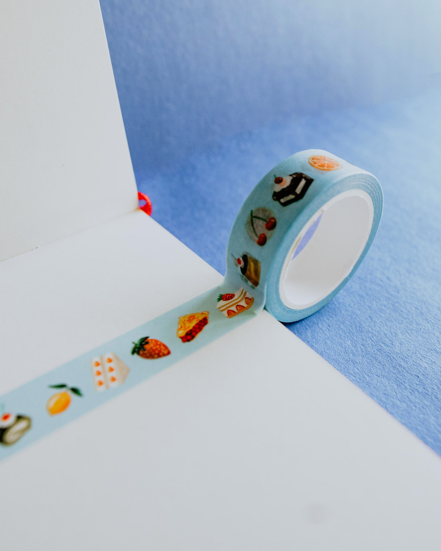 Decorative tape with cartoon designs on a blue and white background, Sweet Tooth Washi Tape