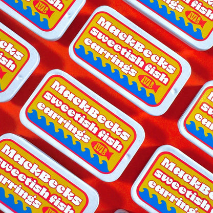 Multiple packaging labels for MackBecks sweetfish carring's on a red background