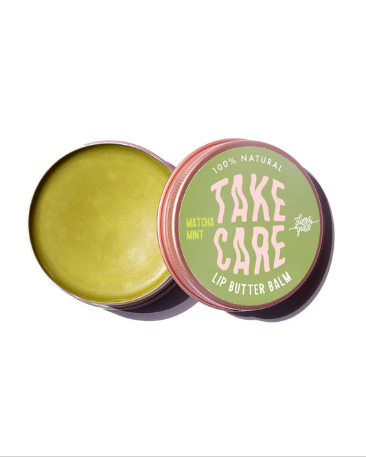 Lip butter balm in a tin with 'Take Care' branding on a white background