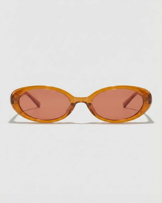 Sunglasses with a caramel colored  frame and pink lenses on a white background