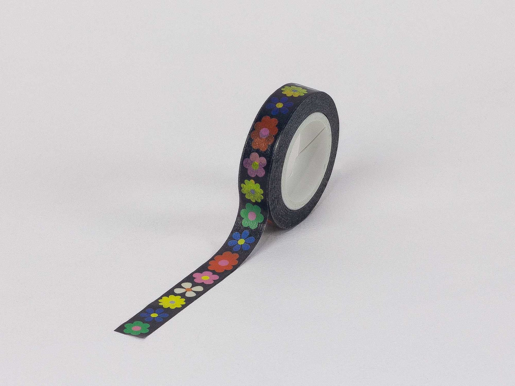 Roll of decorative tape with colorful floral pattern on a white background
