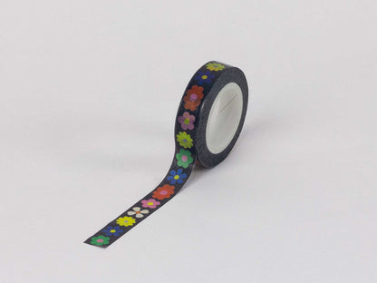 Roll of decorative tape with colorful floral pattern on a white background