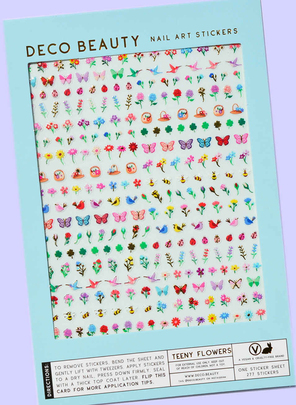 Sheet of Deco Beauty nail art stickers with various designs on a light blue background.
