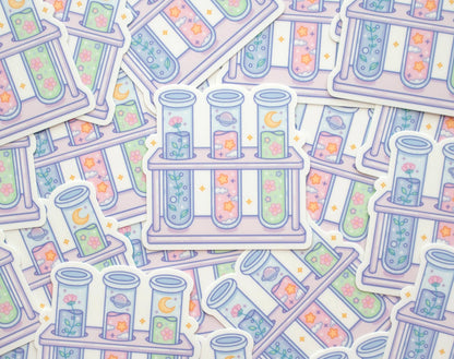 Pattern of test tubes and test tube racks with colorful liquids and flowers on a light background.